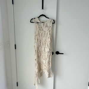 Crocheted asymmetrical dress with slip attached.